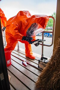 Air Force Staff Sgt. Gregory Kassner, a team member with the 44th Civil Support Team collects a sample of potentially hazardous material during a multi-CST exercise in Ft. Walton Beach, Tuesday May 4.