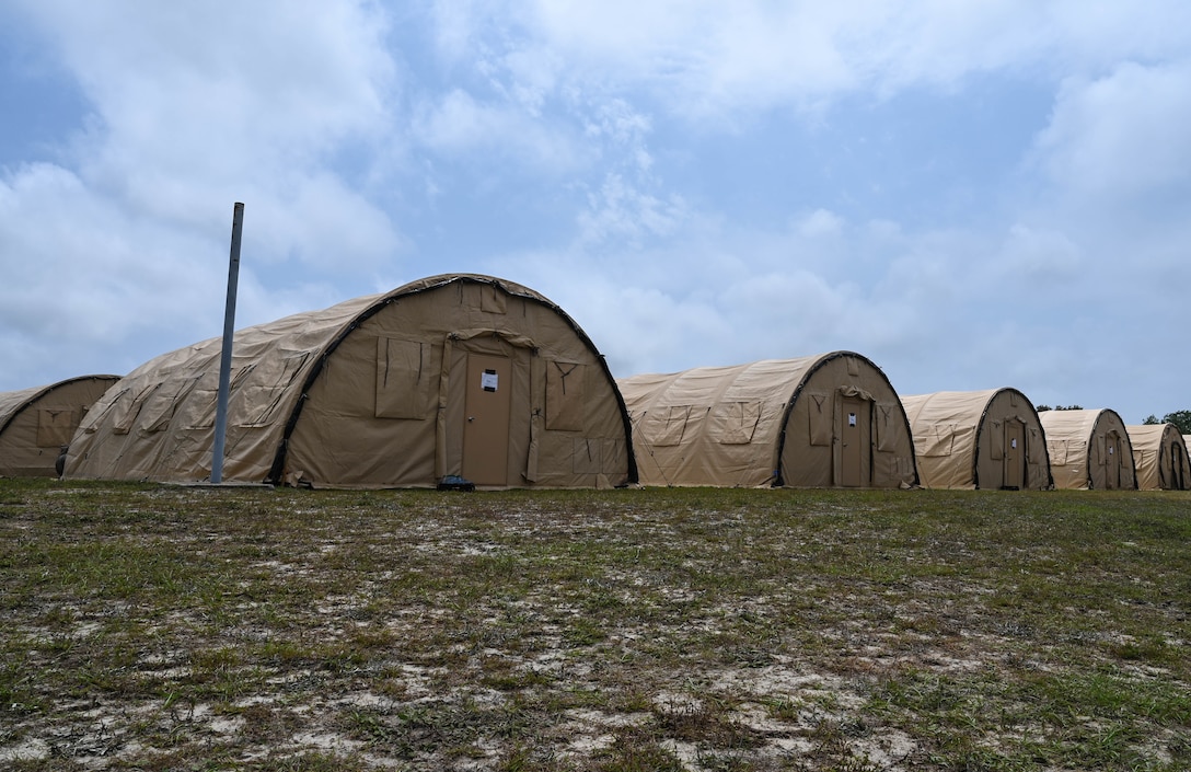 Tents are set in a field at the Agile Flag 21-2 experiment at Naval Outlying Landing Field Choctaw, Florida, May 3, 2021. The tents served as home and shelter for approximately 200 Airmen during the experiment. (U.S. Air Force photo by Senior Airman Sarah Dowe)