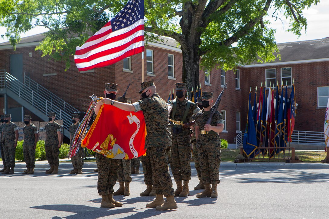 U.S. Marine Corps Master Gunnery Sgt. Daniel Formella, an operations chief and Lt. Col. Matthew Dowden, a commanding officer, both with 2d Tank Battalion, 2d Marine Division (2d MARDIV), case the colors during a deactivation ceremony on Camp Lejeune, N.C., May 5, 2021. This is the next step towards 2d MARDIV’s optimization for future conflicts against peer threats in accordance with the 38th Commandant's Planning Guidance and Force Design 2030. (U.S. Marine Corps photo by Pfc. Sarah Pysher)