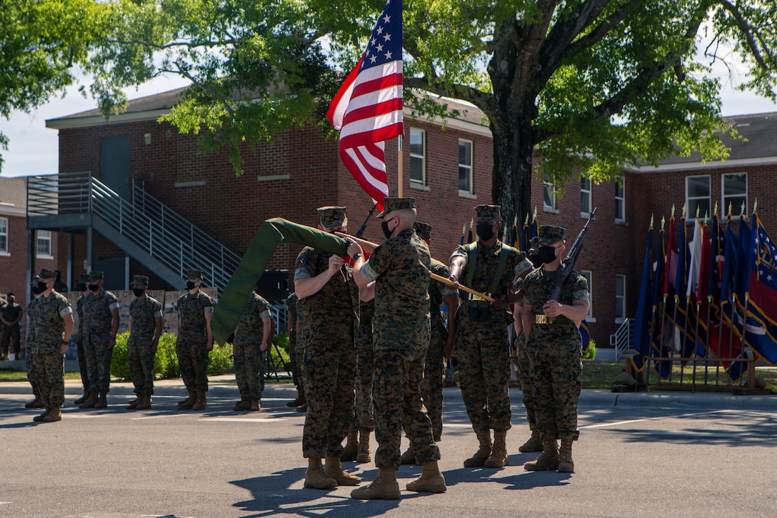 U.S. Marine Corps Master Gunnery Sgt. Daniel Formella, an operations chief and Lt. Col. Matthew Dowden, a commanding officer, both with 2d Tank Battalion, 2d Marine Division (2d MARDIV), case the colors during a deactivation ceremony on Camp Lejeune, N.C., May 5, 2021. This is the next step towards 2d MARDIV’s optimization for future conflicts against peer threats in accordance with the 38th Commandant's Planning Guidance and Force Design 2030. (U.S. Marine Corps photo by Pfc. Sarah Pysher)