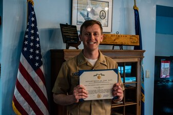 Capt. Steven Antcliff, commanding officer of the Naval Submarine School, presents Lt. Alexander Graham, SUBSCOL Legal Officer, with a Navy and Marine Corps Commendation Medal as an end of tour award during a ceremony at Naval Submarine Base New London, Groton, CT, on May 5, 2020. During his two years as legal officer, Graham flawlessly executed over 600 legal and administrative cases while mentoring and training his staff of mostly out of rate Sailors. Graham's expertise and dedication were critical in maintaining good order and discipline at Naval Submarine School. (U.S. Navy photo by Charles E. Spirtos/Released)