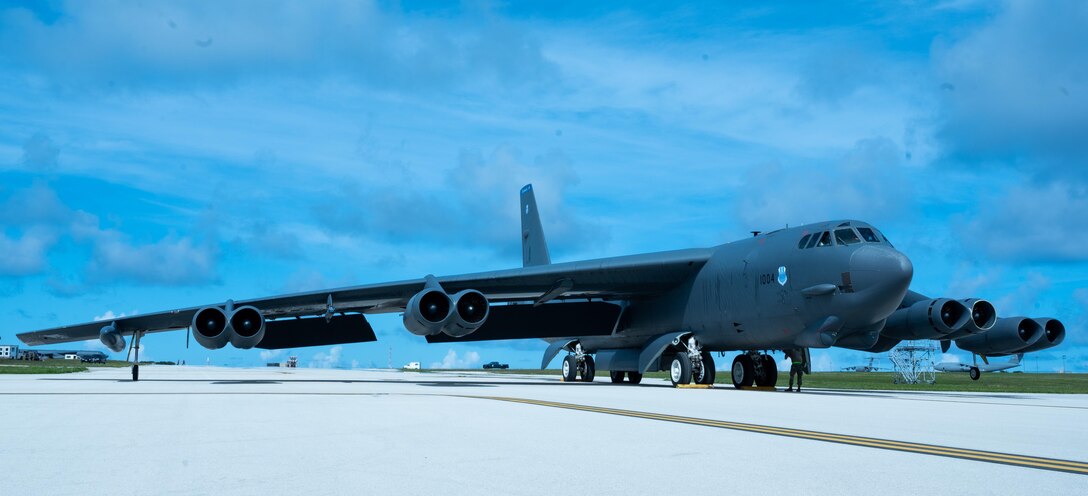 A bomber sits on a runway.