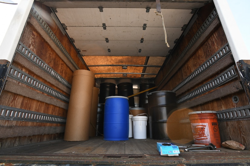 Multiple oil drums wait in the bed of a truck for proper disposal during a hazardous waste turn-in event hosted by the 316th Civil Engineer Squadron at Joint Base Andrews, Md., April 27, 2021. Once collected, they are taken to a hazardous waste storage facility where they’re characterized, labeled and processed before being transported to the final disposal location. (U.S. Air Force photo by Airman 1st Class Bridgitte Taylor)