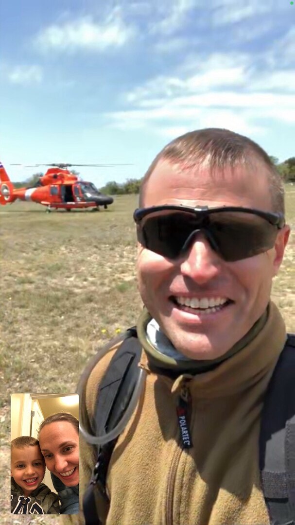 Man taking selfie in front of helicopter with inset of family on screen.