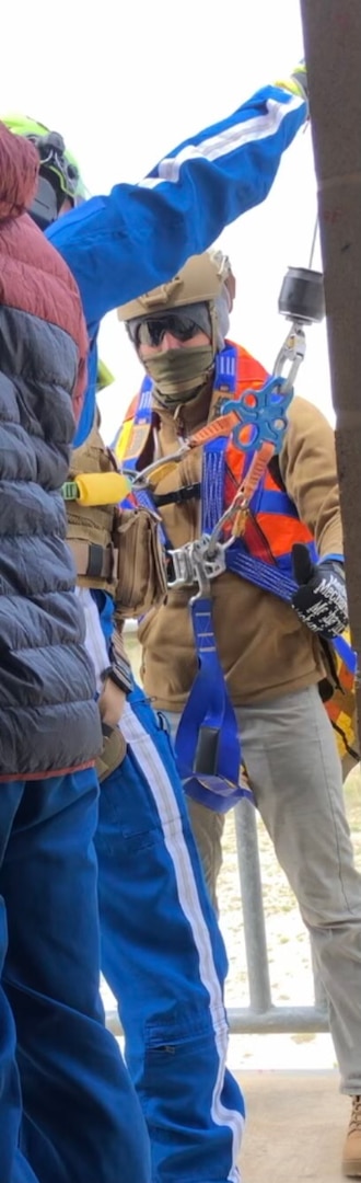 Man in harness on platform