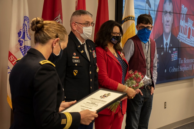 U.S. Army Corps of Engineers - Transatlantic Division Commander, Brigadier General, Kimberly M. Colloton reads the Certificate of Retirement for COL Stephen Bales with his family by his side. COL Bales is retiring after 30 years of service as a U.S. Army Corps of Engineers Officer. He ends his deticated service as the Deputy Commander of the U.S. Army Corps of Engineers - Transatlantic Division, Headquartered in Winchester, Virginia.
