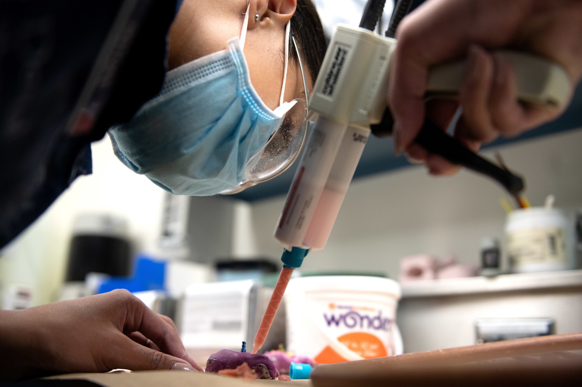 Photos of Airmen working inside the 60th Dental Squadron at Travis AFB
