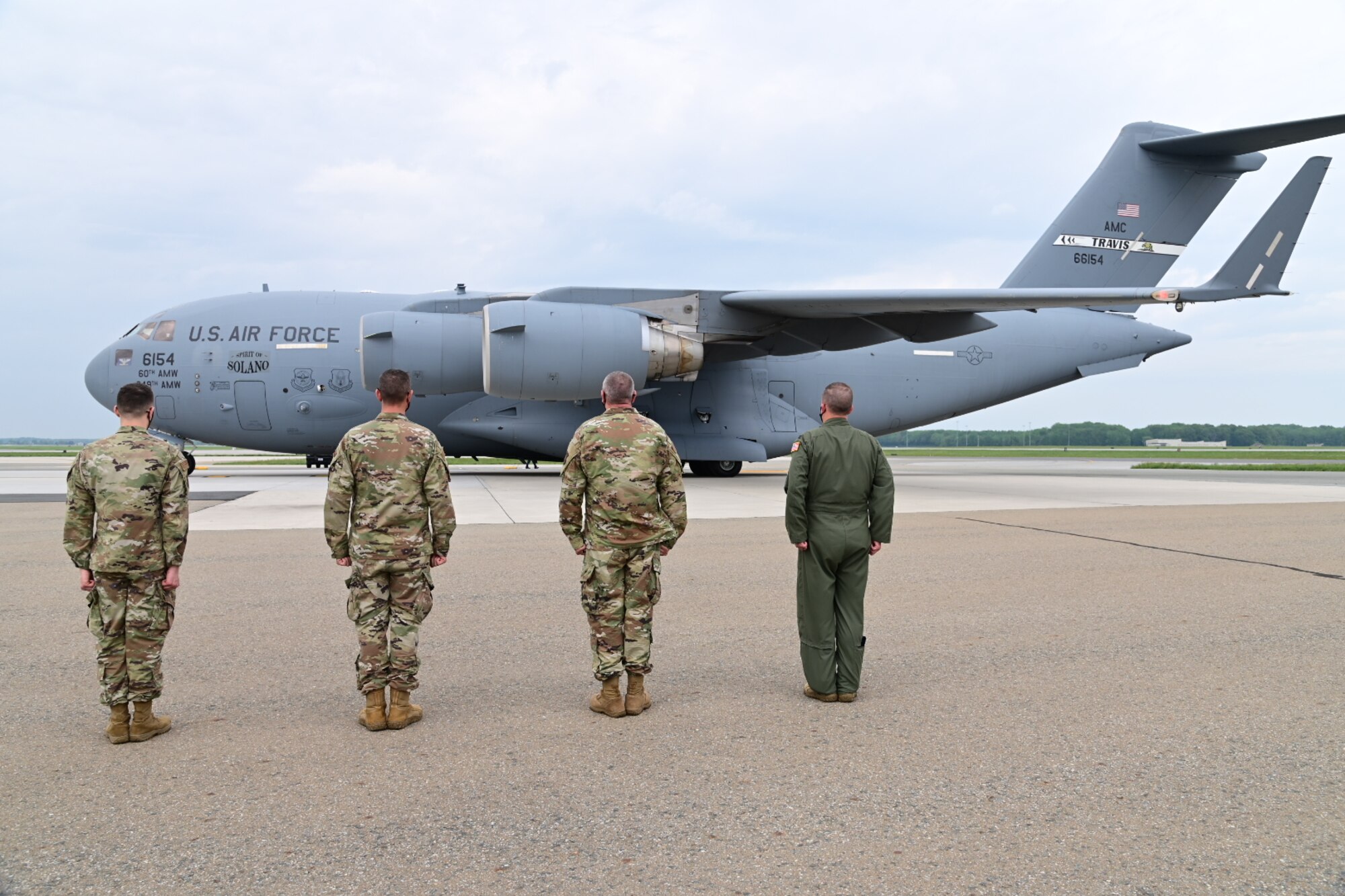 Leadership from the 436th Airlift Wing  prepare to greet leaders and honorary commanders from Travis Air Force Base, California, at Dover AFB, Delaware, May 3, 2021. The group visited multiple facilities at Dover AFB to gain a greater understanding of the base’s mission. (U.S. Air Force photo by Senior Airman Marco A. Gomez)