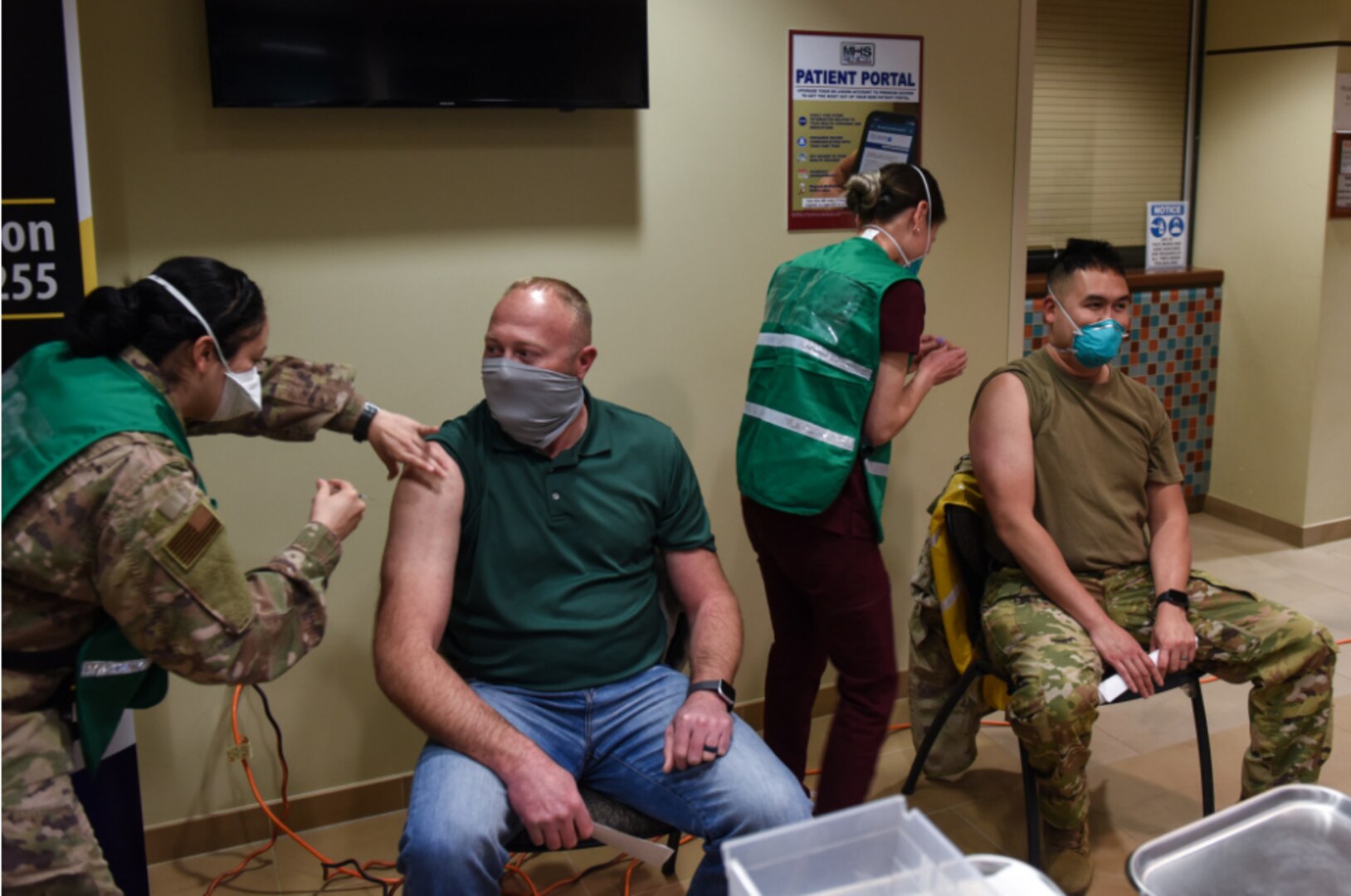 James Haleski, 30th Civil Engineer Squadron chief of readiness and emergency management, and Dr. Paul Vu, 30th Medical Group chief of aerospace medicine, receive COVID-19 vaccinations, Jan. 6, 2021, Vandenberg Air Force Base, Calif.