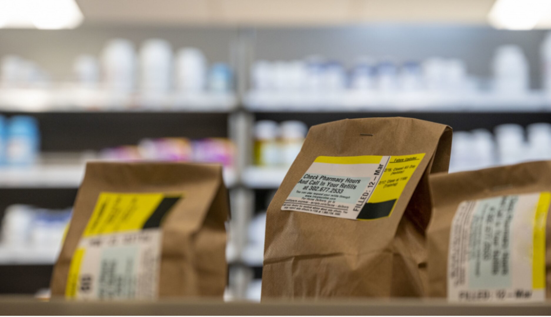 Prescriptions sit on a counter, waiting for delivery in the 436th Medical Group pharmacy at Dover Air Force Base, Delaware, March 12, 2021.