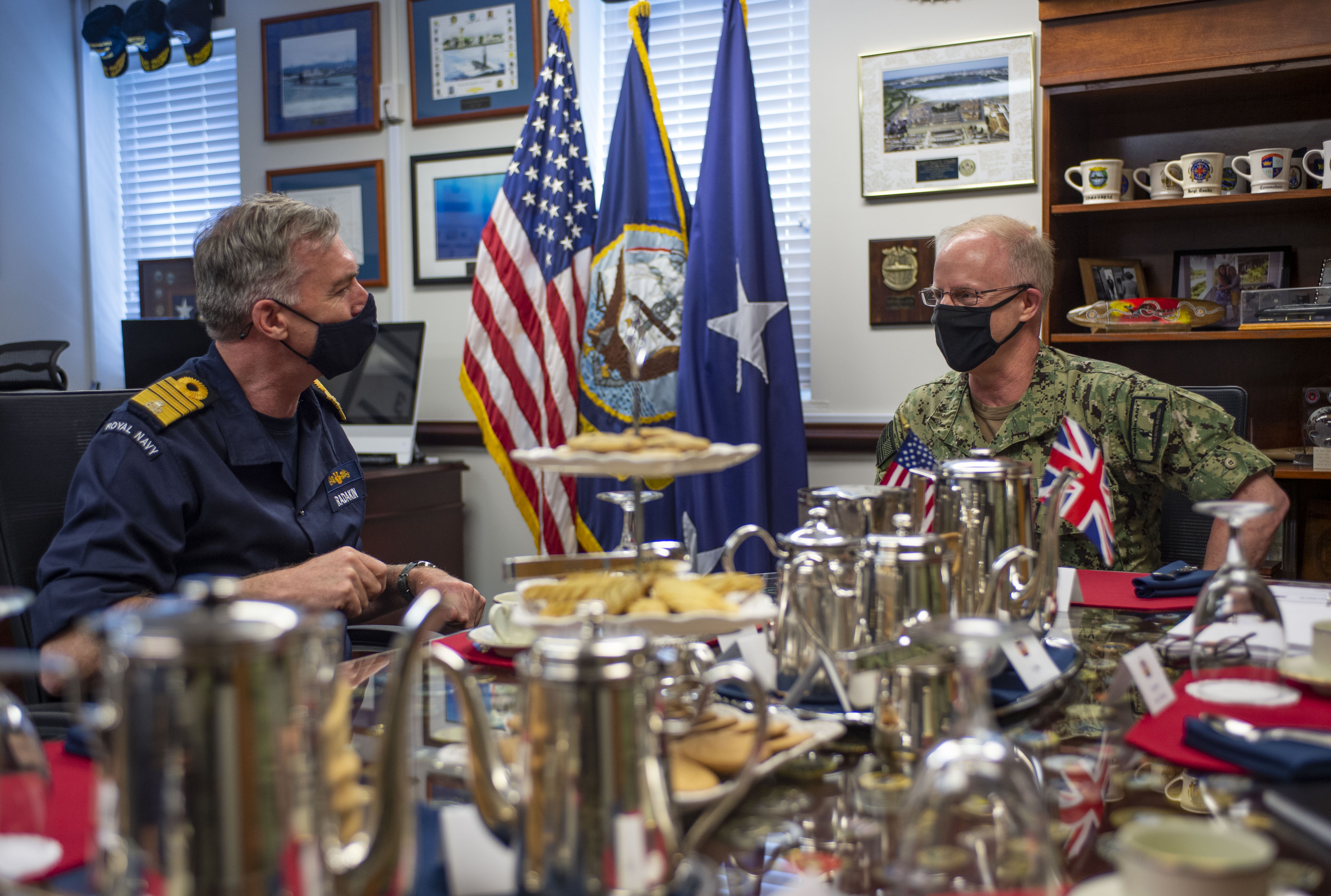 Commander, Submarine Forces Vice Adm. Daryl Caudle speaks with U.K. Royal Navy First Sea Lord and Chief of the Naval Staff Adm. Tony Radakin during an office call to Submarine Forces headquarters in Norfolk, Va., May 6, 2021.