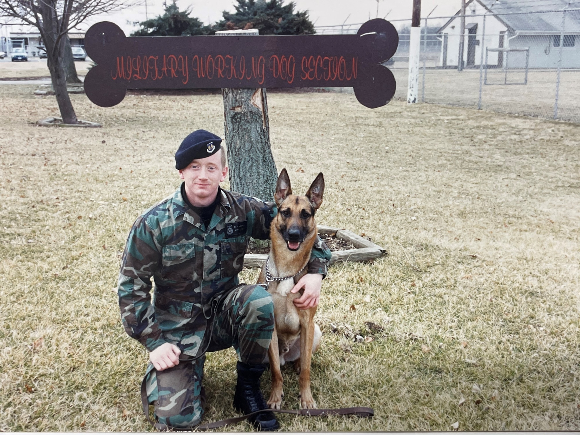 Airman Dan Watson poses with his military working dog, Arco, in front of Wright-Patterson Air Force Base’s kennels in the fall of 1994. Watson served his first assignment here as a military working dog handler before returning 25 years later as deputy chief and chief of acquisition law at the AFMC Law Office. (Contributed photo)