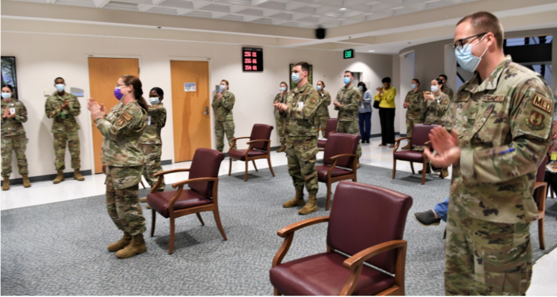 ROBINS AIR FORCE BASE, Ga. – Members of the 78th Medical Group celebrate inside the clinic’s atrium at Robins Air Force Base, Georgia, March 1, 2021.