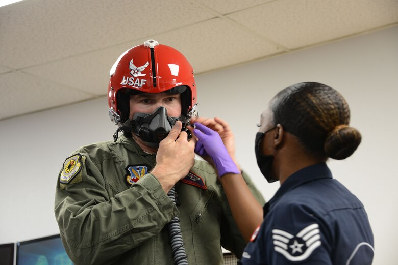 Former Ultimate Fighter Championship champion and UFC Hall of Famer Forrest Griffin getting fitted with a helmet prior to flying with the U.S. Thunderbirds at Nellis Air Force Base, Nevada, Apr. 23, 2021.