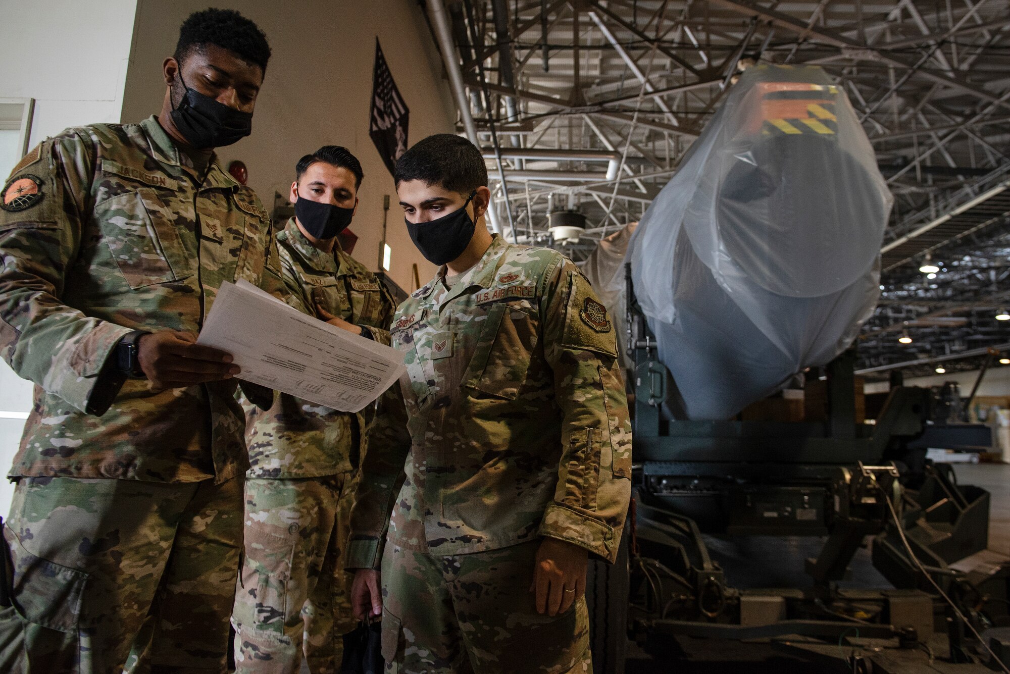 From left to right, Staff Sgt. Donald Jackson, 730th Air Mobility Squadron freight supervisor, Staff Sgt. Michael Freitas, 730th AMS aerospace propulsion craftsman, and Staff Sgt. Michael Freitas, 730th AMS air freight shift supervisor, inspect and prepare a C-17 engine to be loaded onto a C-17 Globemaster III, May 4, 2021, at Yokota Air Base, Japan. The 730th AMS gave the engine to Kadena Air Base airmen assigned to the 733rd AMS to enhance their training program, allowing maintainers to navigate nomenclature and troubleshoot engine issues on a real aircraft asset. Finding ways to improve training helps increase the readiness and resilience of our force and ensures Pacific Air Forces’ ability to fight and win if needed.