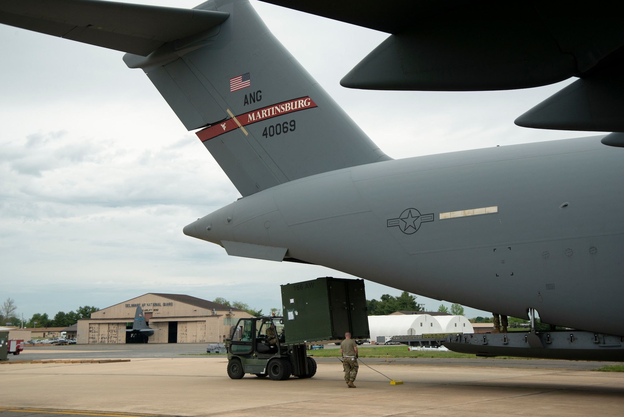 The 167th and 166th Airlift Wings partnered together to conduct a joint cargo loading exercise as part of the 166th's home station operational readiness exercise on May 3 at New Castle Air National Guard Base, Delaware.