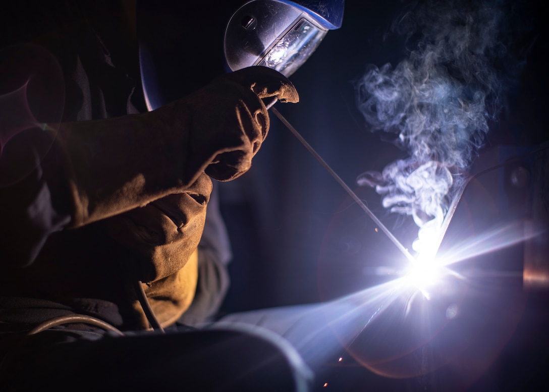 A U.S. Navy sailor welds oxygen tank brackets for the Portland medical clinic, April 26.