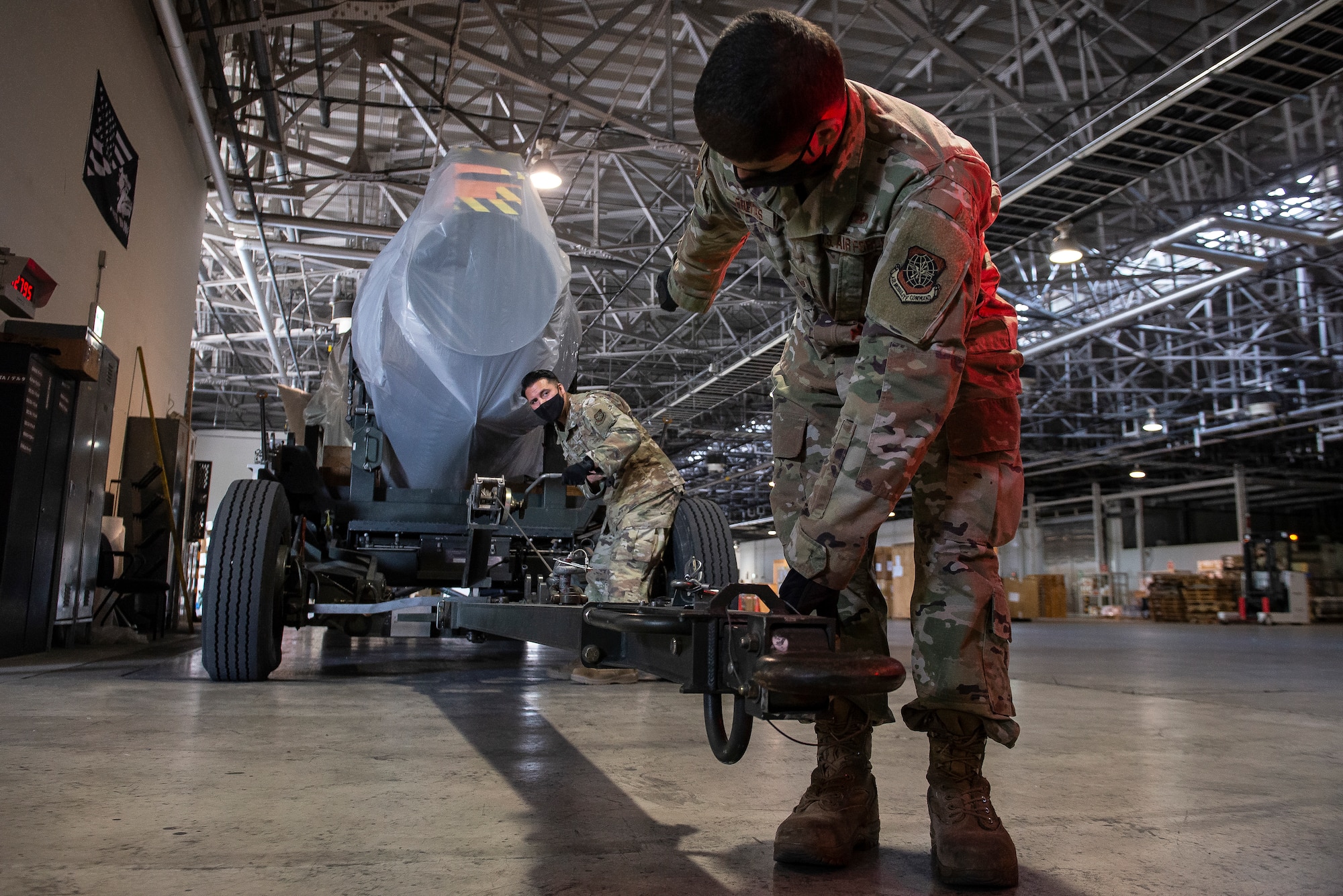 Staff Sgt. Michael Freitas, right, 730th Air Mobility Squadron air freight shift supervisor, and Staff Sgt. Adrian Diaz, left, 730th AMS aerospace propulsion craftsman, weigh a C-17 engine prior to loading it onto a C-17 Globemaster III, May 4, 2021, at Yokota Air Base, Japan. The 730th AMS gave the engine to Kadena Air Base airmen assigned to the 733rd AMS to enhance their training program, allowing maintainers to navigate nomenclature and troubleshoot engine issues on a real aircraft asset. Finding ways to improve training helps increase the readiness and resilience of our force and ensures Pacific Air Forces’ ability to fight and win if needed.