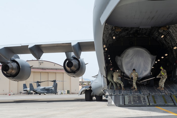 Airmen assigned to the 730th Air Mobility Squadron load a C-17 engine onto a C-17 Globemaster III May, 4, 2021, at Yokota Air Base, Japan. The 730th AMS gave the engine to Kadena Air Base Airmen assigned to the 733rd AMS to enhance their training program, allowing maintainers to sharpen their skills on a real asset without the chance of damaging an operational aircraft. Finding ways to improve training helps increase the readiness and resilience of our force and ensures Pacific Air Forces’ ability to fight and win if needed.