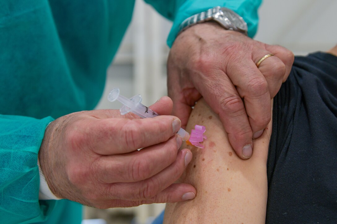 Gianpietro Polo Friz, 31st Civil Engineer Squadron purchasing agent, receives his first Moderna COVID-19 vaccine shot at Aviano Air Base, Italy, May 7, 2021. The vaccine is available to all 31st Fighter Wing local national employees. Local national employees make up a large percentage of Aviano’s workforce and are crucial to completing the mission. (U.S. Air Force photo by Airman 1st Class Brooke Moeder)