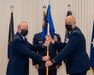 Brig. Gen. Michael J. Regan, left, Commander of the Pennsylvania Air National Guard, presents the 171st Air Refueling Wing guidon to Col. Raymond L. Hyland Jr., incoming 171st ARW commander, during a change of command ceremony May 6, 2021, in Coraopolis, Pennsylvania. Upon taking command, Hyland became the wing’s 23rd commander. (U.S. Air National Guard photo by Staff Sgt. Zoe M. Wockenfuss)