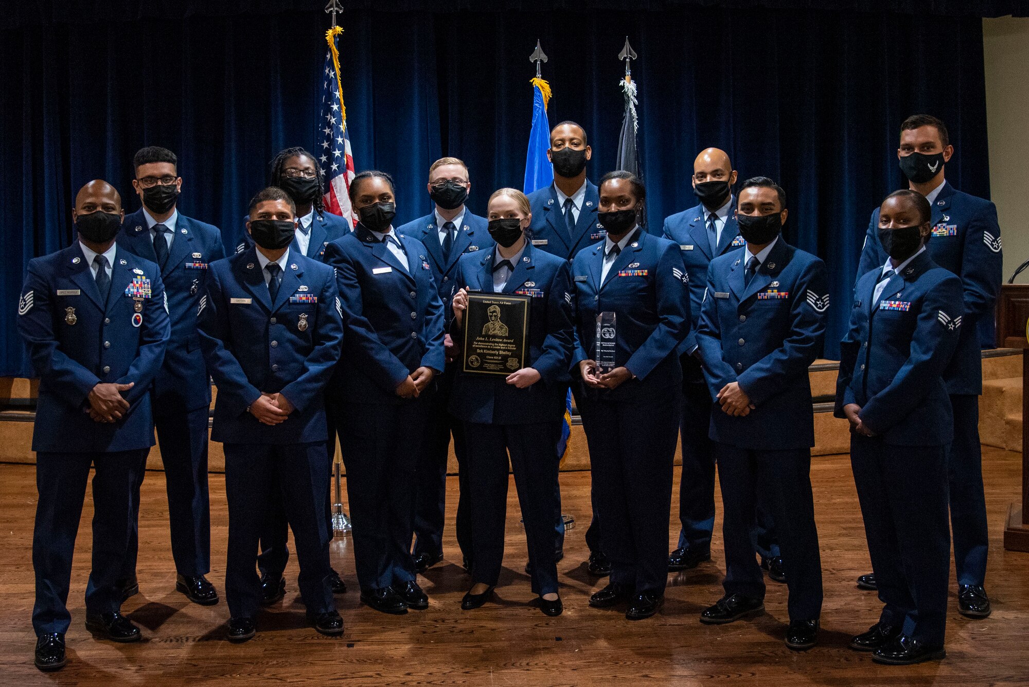Airman Leadership School Class 21-D students, pause for a photo following an ALS graduation ceremony, May 6, 2021 at MacDill Air Force Base, Florida.