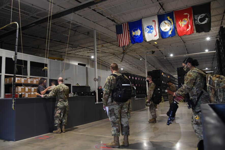 375th Logistics Readiness Squadron Airmen are issued deployment gear during a mobility exercise, on Scott Air Force Base, Illinois, April, 28 2021. Units simulated deployment processes during the three day exercise to ensure mission readiness. (U.S. Air Force photo by Airman 1st Class Mark Sulaica)