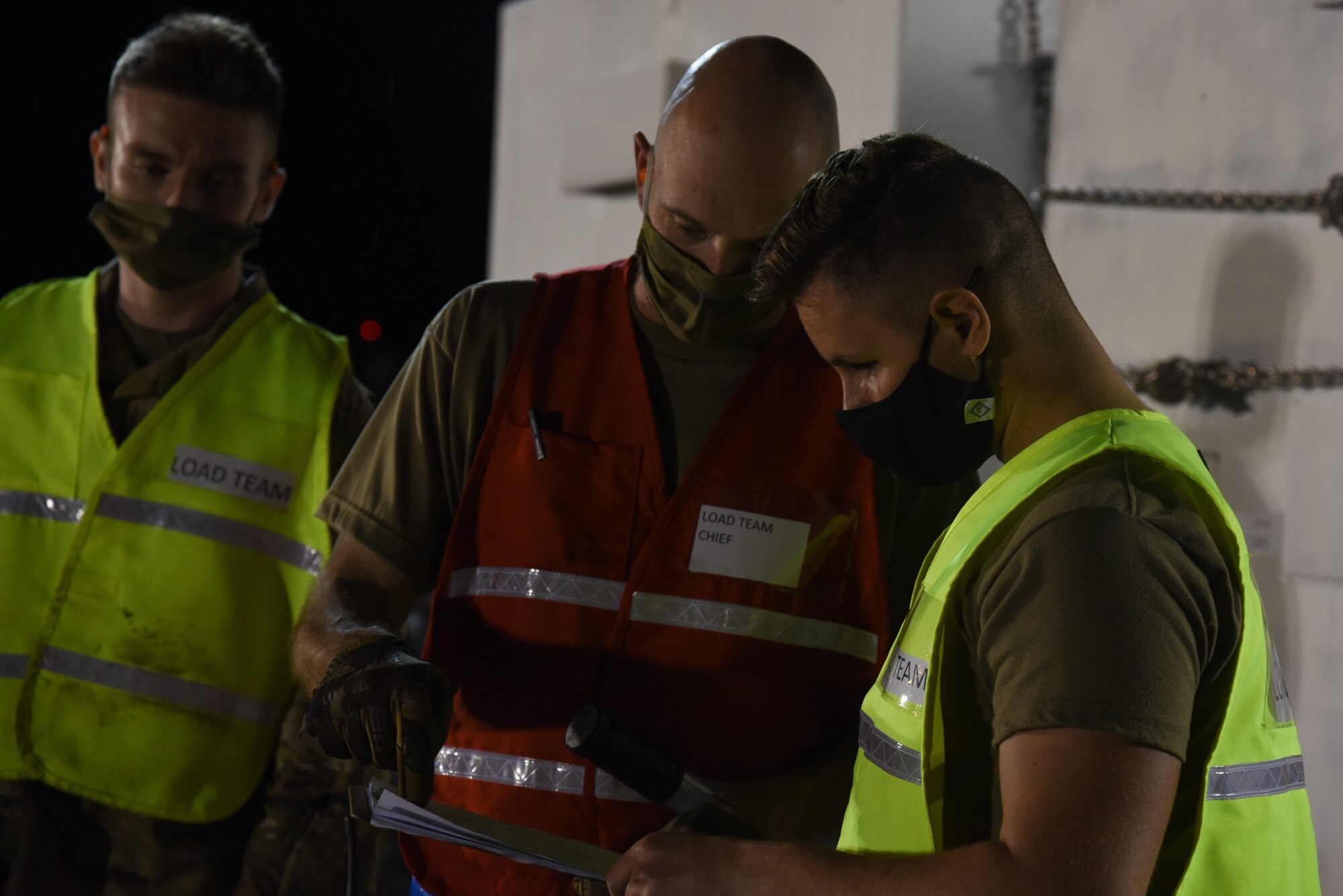 375th Logistics Readiness Squadron Airmen review the times of cargo being moved during a mobility exercise on Scott Air Force Base, Illinois, April, 28 2021. The 375th LRS simulated the process of moving cargo received from multiple units during the exercise. (U.S. Air Force photo by Airman 1st Class Mark Sulaica)