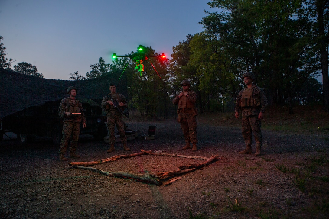 U.S. Marines with 1st Battalion, 10th Marine Regiment, 2nd Marine Division, observe a R-80D SkyRaider drone land during Exercise Rolling Thunder 21.2 on Fort Bragg, N.C, April 20, 2021. This is a live-fire artillery exercise where 10th Marines employed distributed fires via simulated Expeditionary Advanced Bases. The training increased 2nd MARDIV’s combat readiness against a peer competitor. Small unmanned aerial systems provide increased situational awareness and act as a sensor for expediting decision making.