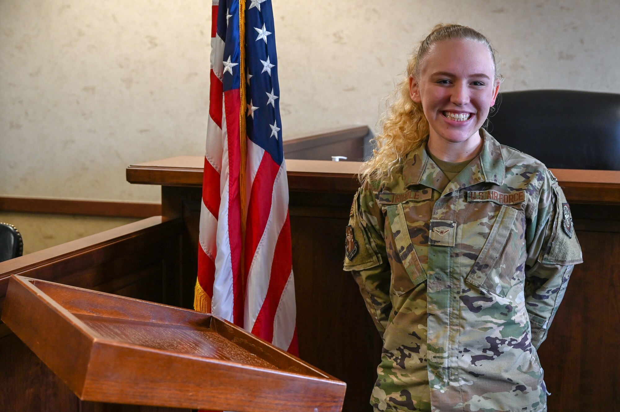 An airman poses for a photo.