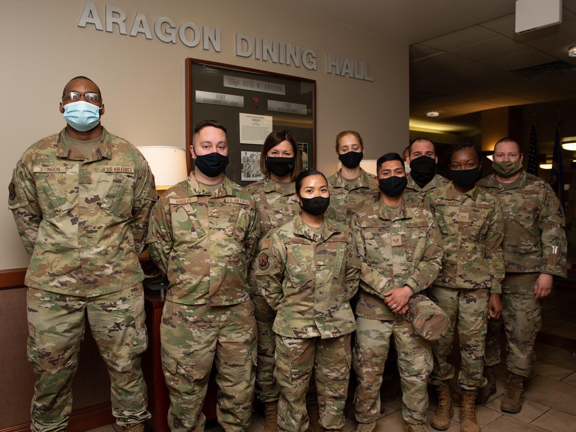 Chief Bass poses with DFAC personnel for a photo