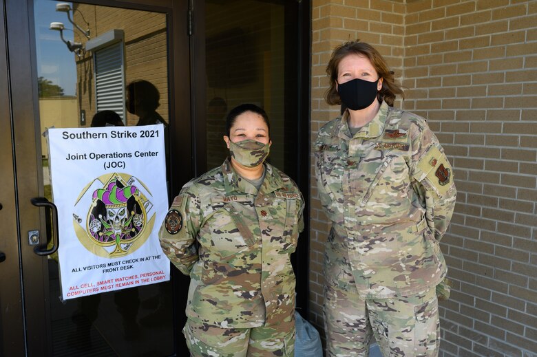 (From left) U.S. Air Force Maj. Christina Mayo, cyber operator for the 175th Cyberspace Operations Squadron, Maryland Air National Guard, pose for a photo with U.S. Air Force Col. Cindy Smith, the exercise director of Southern Strike 21, on April 22, 2021, at the Gulfport Combat Readiness Training Center, Gulfport, Mississippi