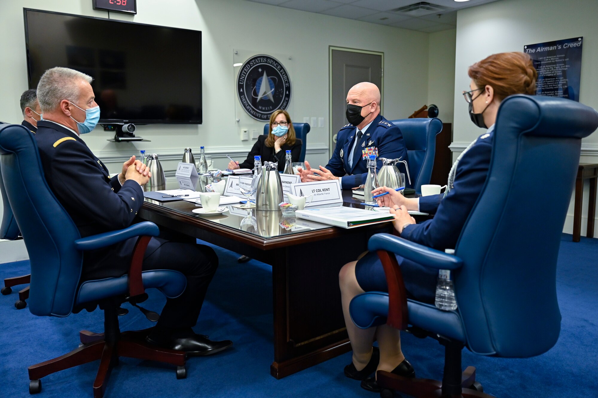 Chief of Space Operations Gen. John W. Raymond, second from right, speaks with Maj. Gen. Michel Friedling, left, commander of French Space Command, during a meeting at the Pentagon.