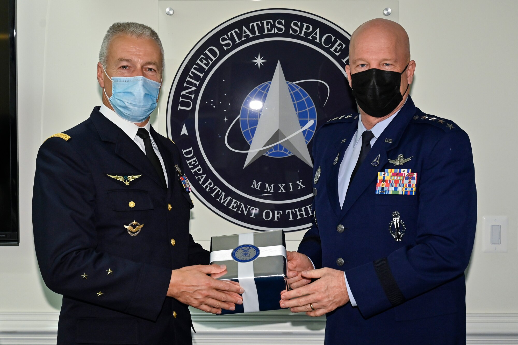 Chief of Space Operations Gen. John W. Raymond, right, poses with Maj. Gen. Michel Friedling, commander of French Space Command