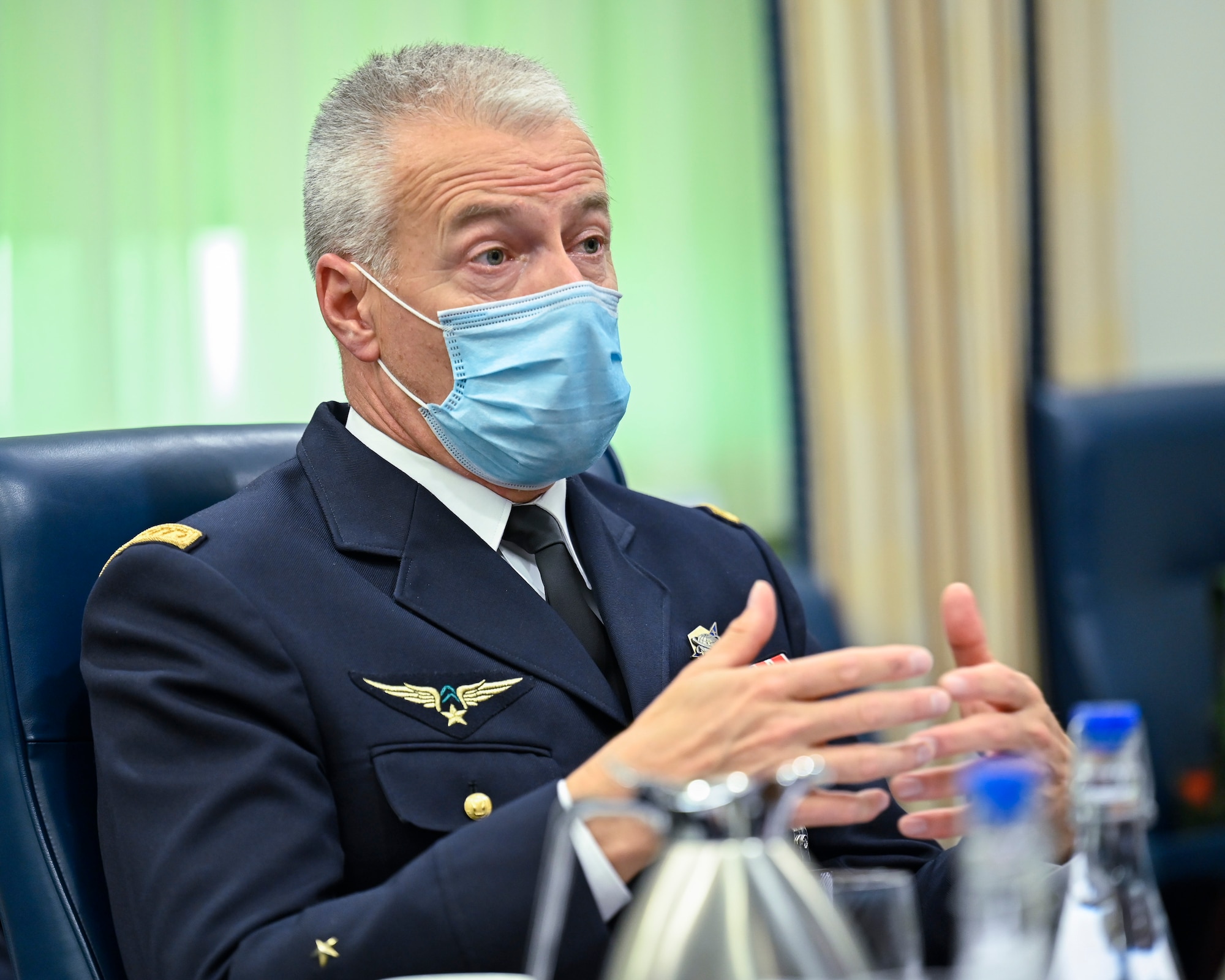 Maj. Gen. Michel Friedling, commander of French Space Command, speaks with Chief of Space Operations Gen. John W. Raymond during a meeting.