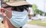 Spc. Brett Lima, a HIMARS operator with 3rd Battalion, 197th Field Artillery Brigade, NHARNG, waits patiently for the next row of cars at a mobile pantry in Laconia on July 10, 2020. Lima has remained on active duty orders in support of various state COVID-19 relief efforts.