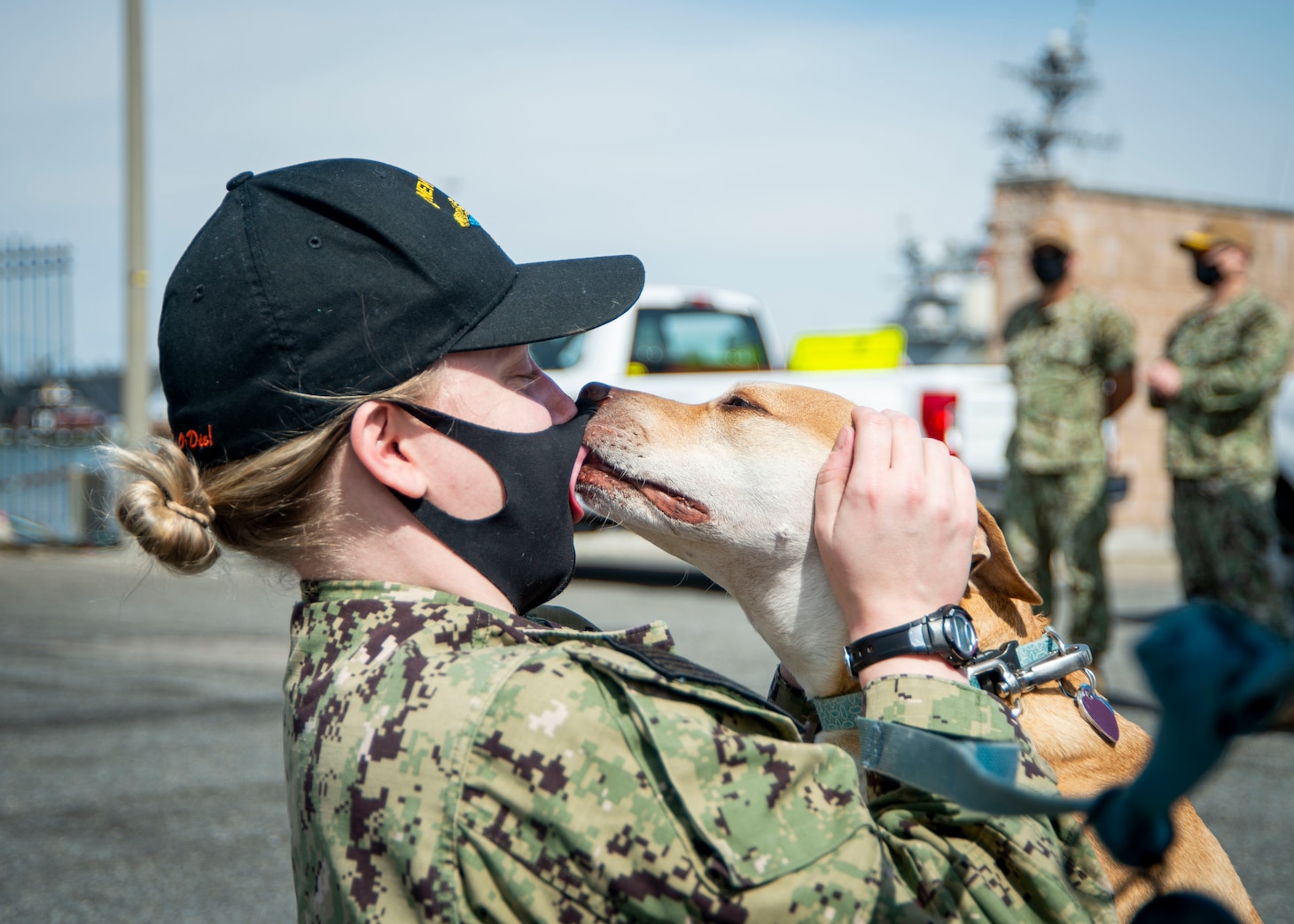 Lt.  j .g. Amanda Langhauser, assigned to USS New Hampshire (SSN 778), is greeted by her dog during the boat’s homecoming at Naval Station Norfolk.