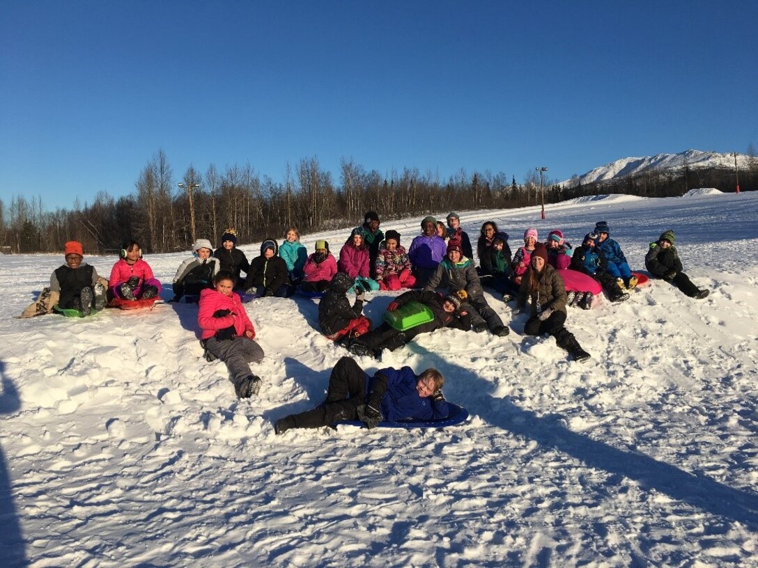 Photo of teacher and students