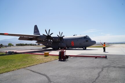 C130-E Hercules aircraft from the 152nd Airlift Wing during MAFFS (Modular Airborne Fire Fighting System) training at the San Bernardino Air Tanker Base, California. May 5, 2021.