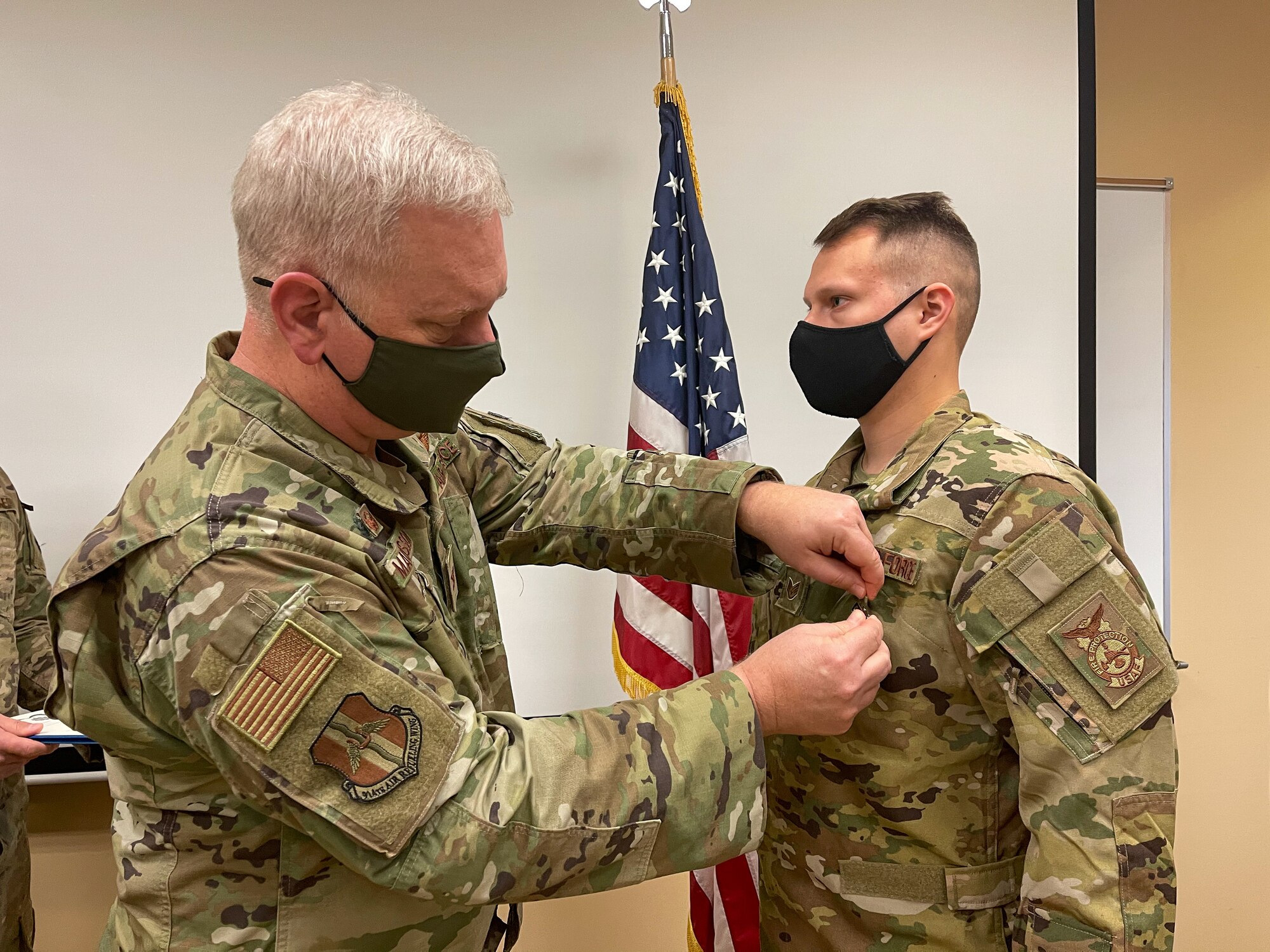Pinning on medal