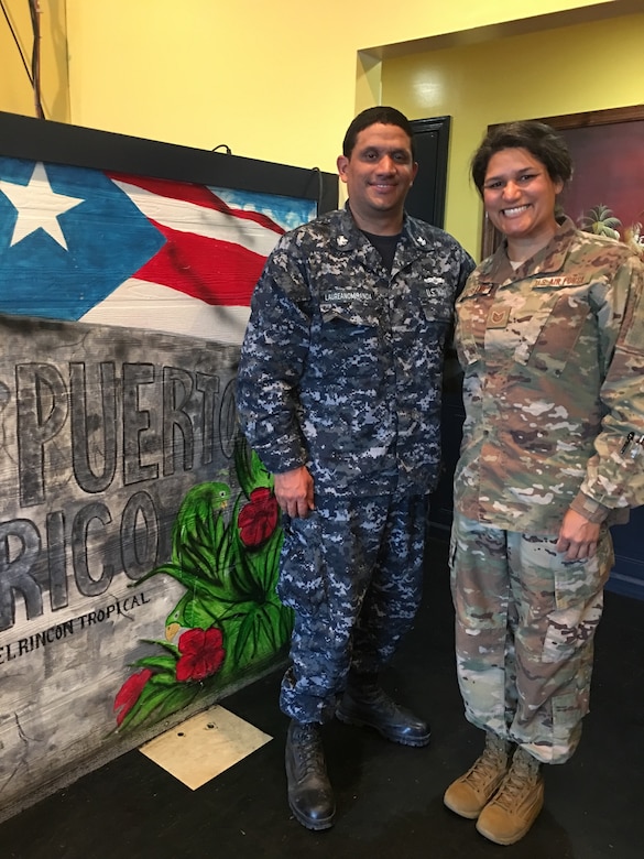 Two service members pose for a photo.