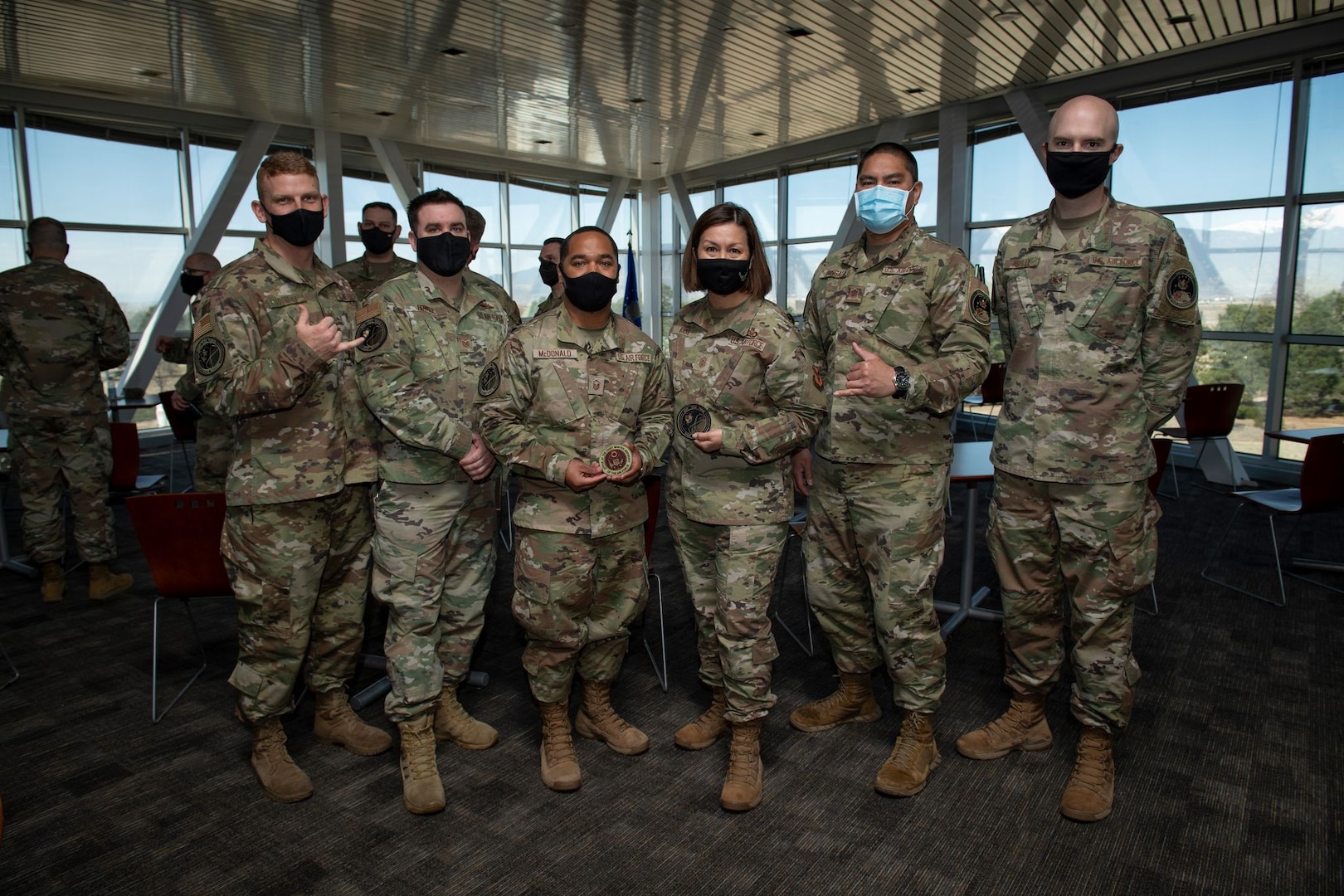 Chief Master Sergeant of the Air Force JoAnne S. Bass (fourth from left) is pictured with Airmen assigned to U.S. Space Command's Joint Task Force-Space Defense after exchanging patches with them May 7 at USSPACECOM headquarters at Peterson Air Force Base, Colorado.