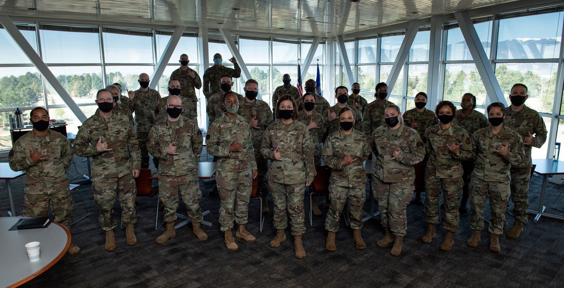 Chief Master Sergeant of the Air Force JoAnne S. Bass (center) is pictured with U.S. Air Force personnel assigned to U.S. Space Command on May 7 at Peterson Air Force Base, Colorado.