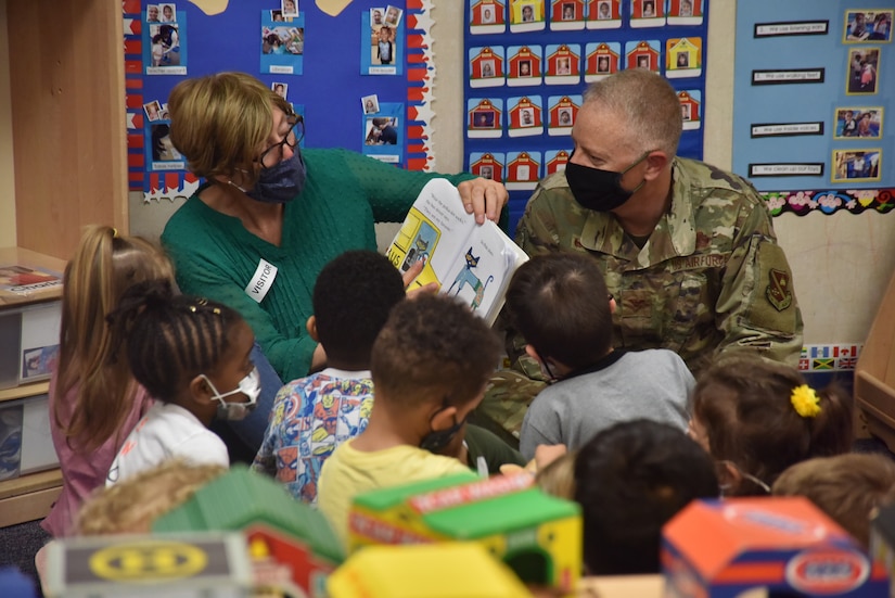 Col. Tyler Schaff, 316th Wing and Joint Base Andrews commander, and his wife, Ellen Schaff, visit Child Development Center 3 to read books to the children and spend time with them as a thank you, April 28, 2021, at Joint Base Andrews, Md. April is designated as the Month of the Military Child, underscoring the important role military children play in the armed forces community. (U.S. Air Force photo by Senior Airman Daniel Brosam)