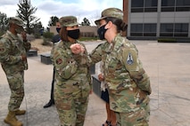 Chief bass elbow bumps with P-S Gar Airman