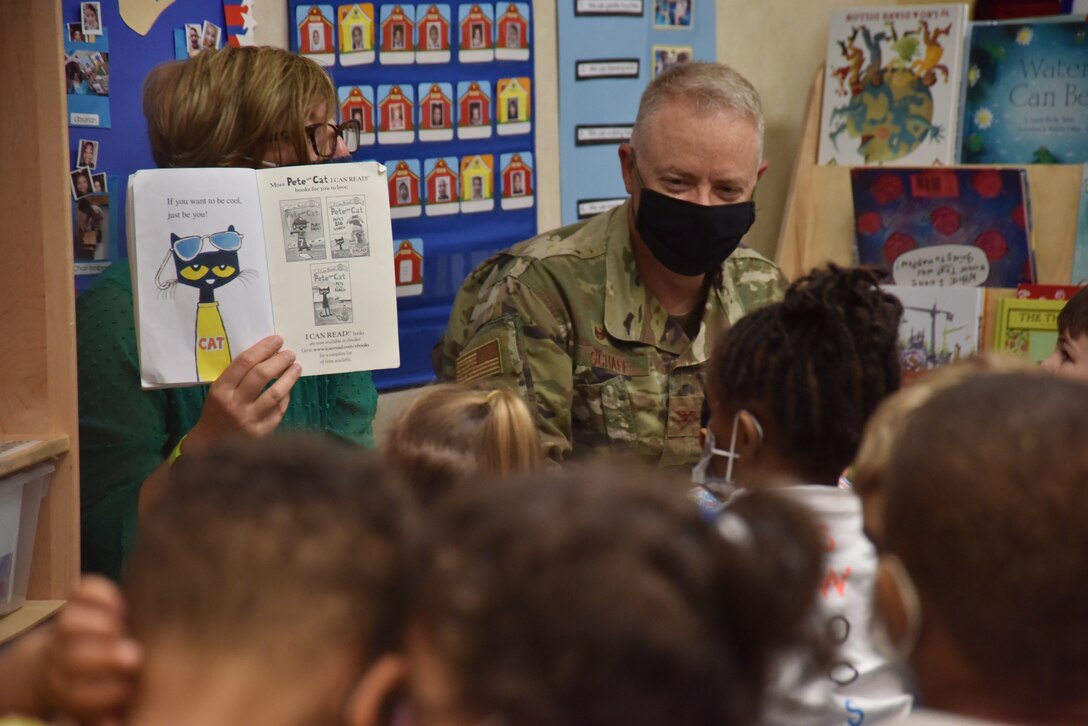 Col. Tyler Schaff, 316th Wing and Joint Base Andrews commander, and his wife, Ellen Schaff, visit Child Development Center 3 to read books to the children and spend time with them as a thank you, April 28, 2021, at Joint Base Andrews, Md. April is designated as the Month of the Military Child, underscoring the important role military children play in the armed forces community. (U.S. Air Force photo by Senior Airman Daniel Brosam)