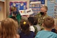 Col. Tyler Schaff, 316th Wing and Joint Base Andrews commander, and his wife, Ellen Schaff, visit Child Development Center 3 to read books to the children and spend time with them as a thank you, April 28, 2021, at Joint Base Andrews, Md. April is designated as the Month of the Military Child, underscoring the important role military children play in the armed forces community. (U.S. Air Force photo by Senior Airman Daniel Brosam)