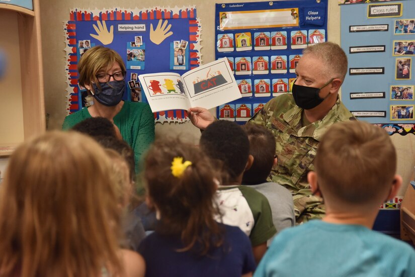 Col. Tyler Schaff, 316th Wing and Joint Base Andrews commander, and his wife, Ellen Schaff, visit Child Development Center 3 to read books to the children and spend time with them as a thank you, April 28, 2021, at Joint Base Andrews, Md. April is designated as the Month of the Military Child, underscoring the important role military children play in the armed forces community. (U.S. Air Force photo by Senior Airman Daniel Brosam)