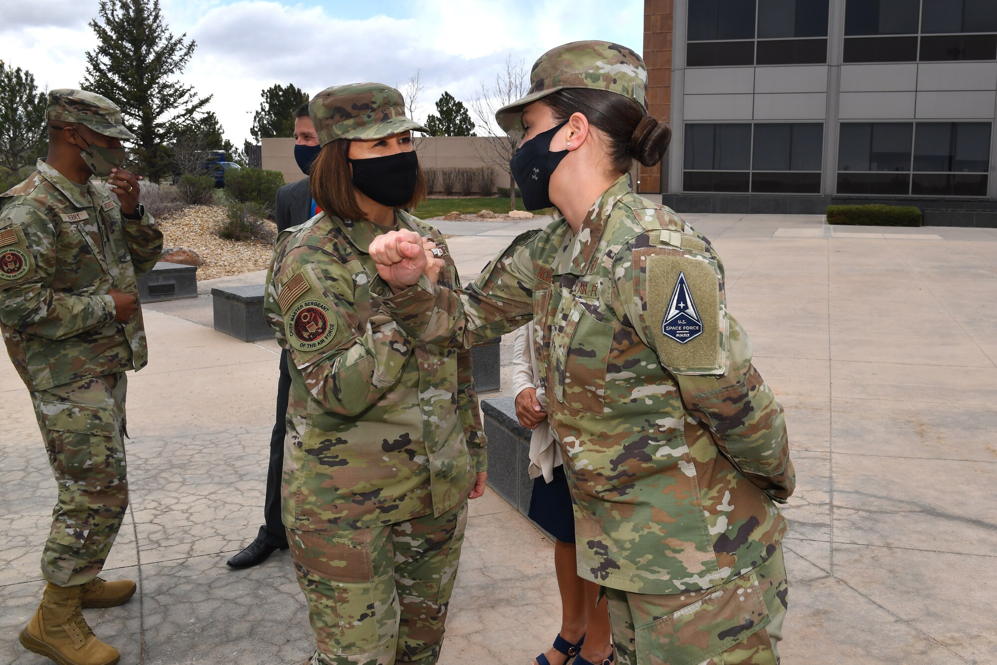 Chief bass elbow bumps with P-S Gar Airman