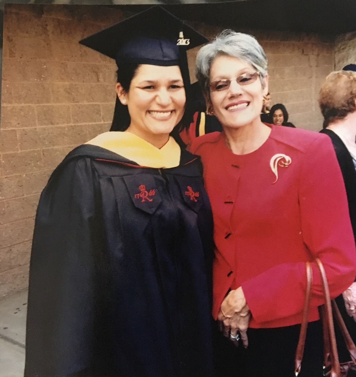 Two women pose for a photo.